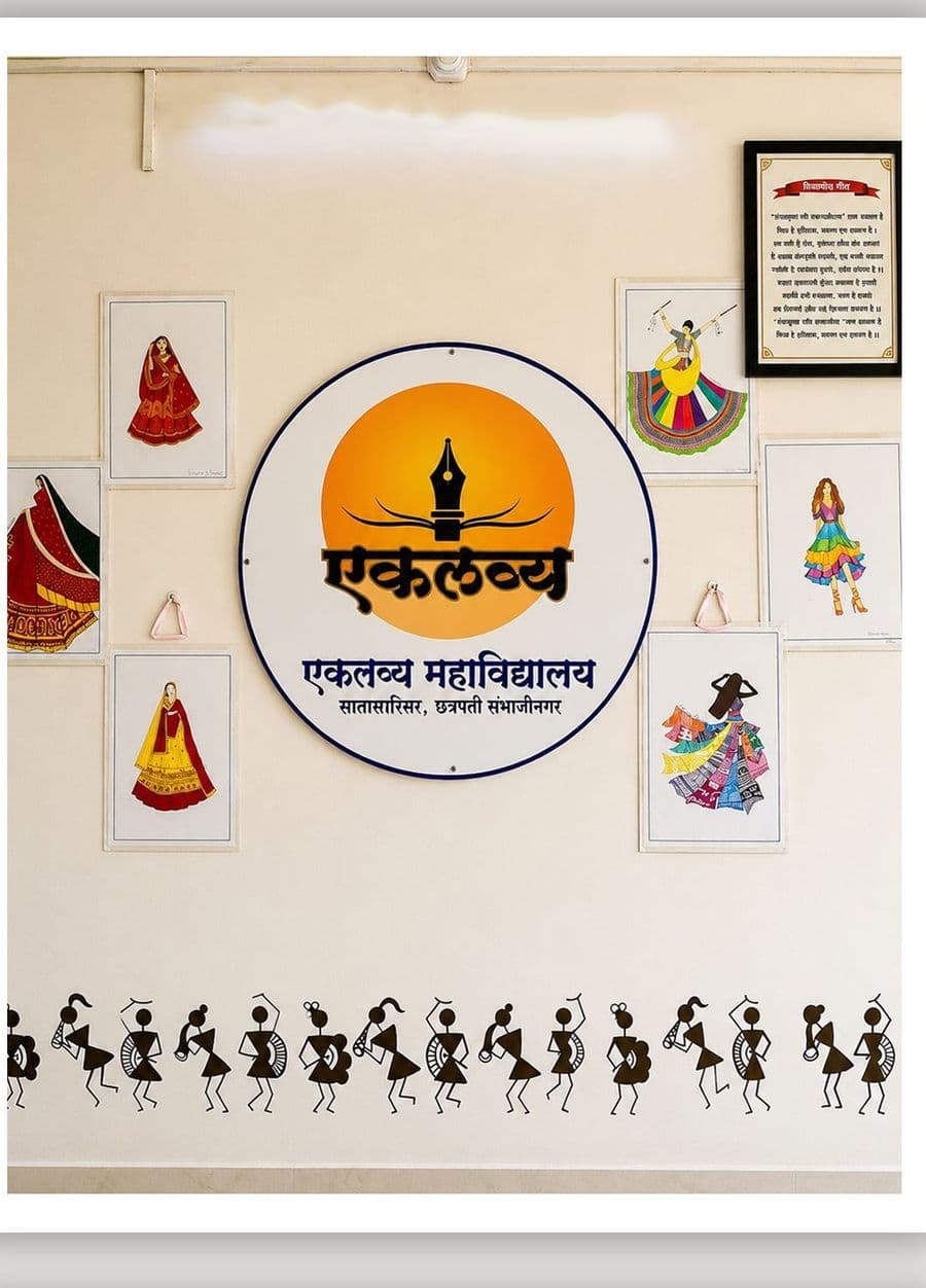 The college crest on a wall surrounded by student fashion illustrations